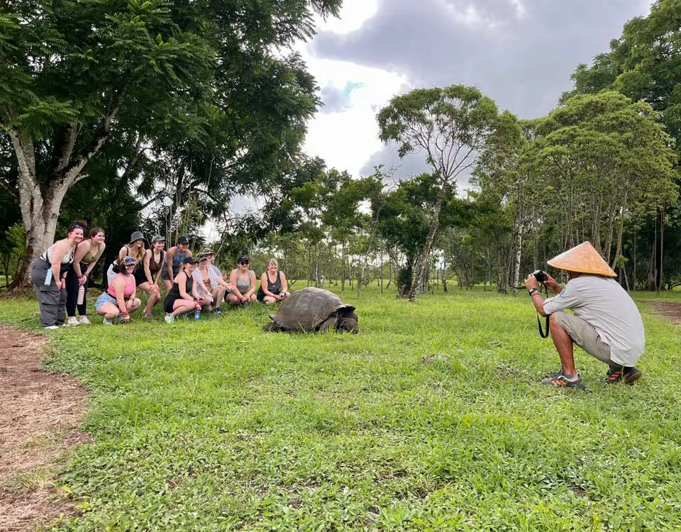 59_people-taking-a-picture-with-a-galapagos-giant-tortoise-1